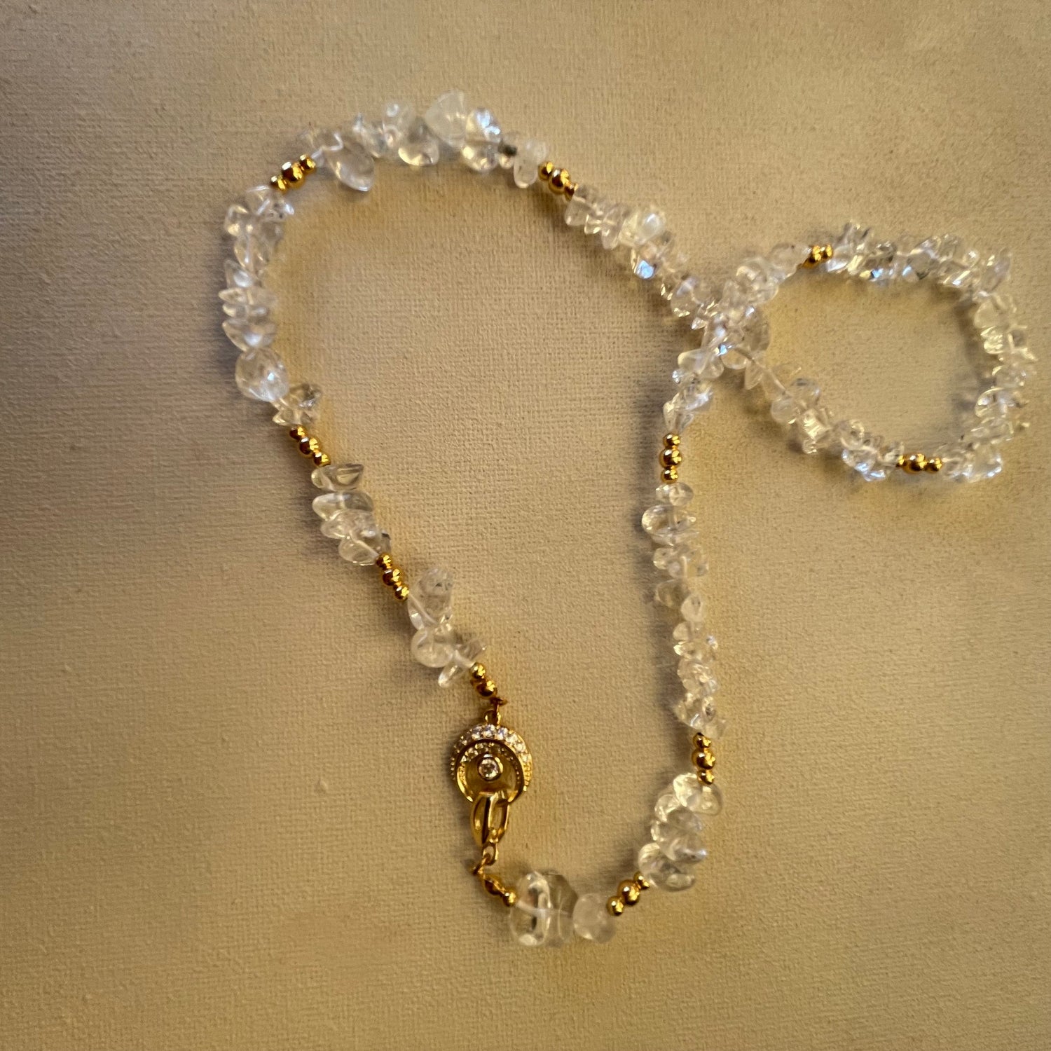 Clear Quartz necklace with gold accents and front moon clasp